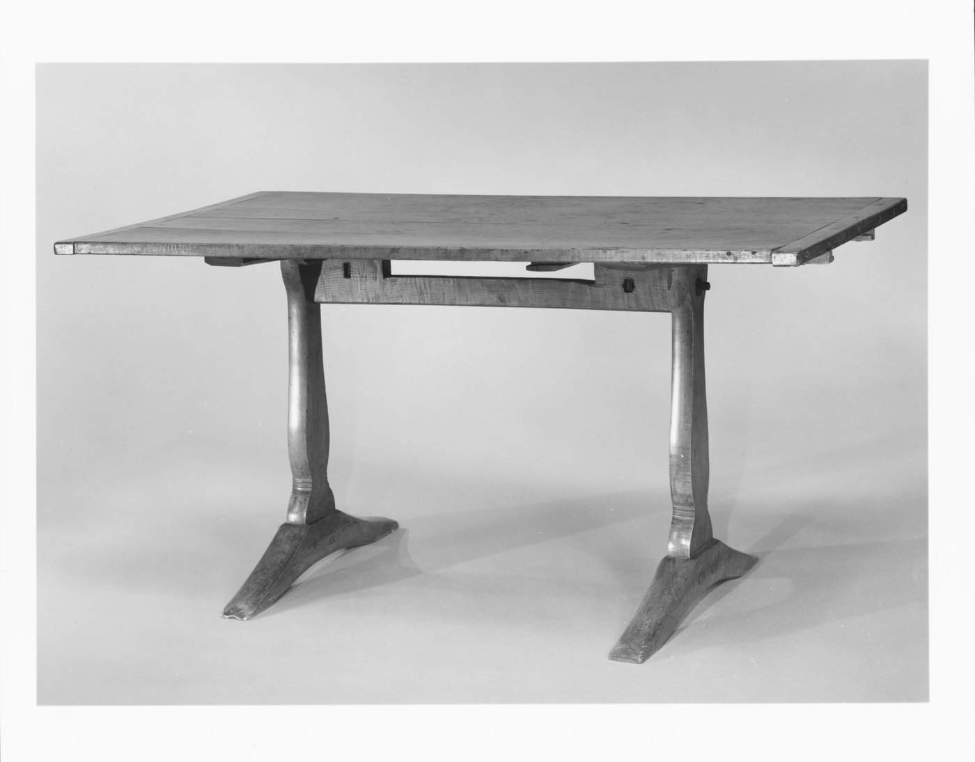 Trestle dining table in maple and ash